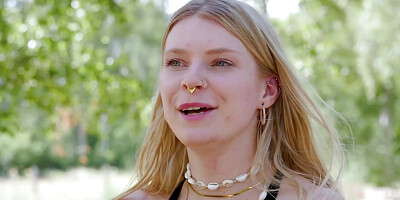 First-year biker Katja E relaxes on the meadow with dildo and butt plug