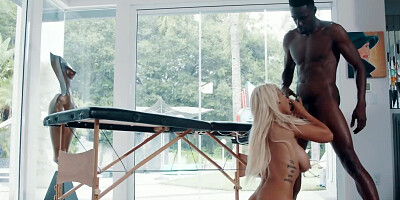 Busty blonde babe enjoys interracial sex after a massage