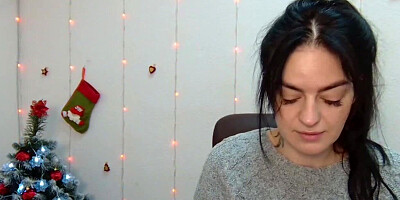 Brunette babe in grey sweater posing