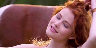Redhead Latvian diva reveals her boobs