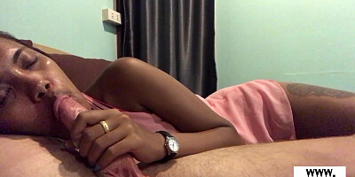 Amateur Thai teen sucks a big white cock