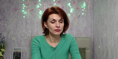 Busty ginger MILF showing boobs in sweater