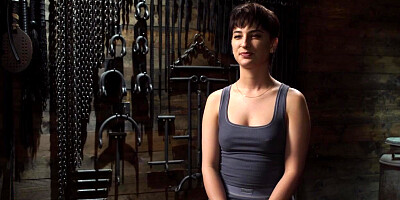 Bound to a wooden horse and vibrated by master