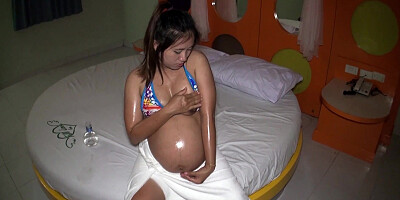 Pregnant Thai wife jerks her mans cock