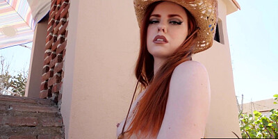 Naked red Krystal Kitten posing outdoor