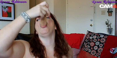 Redheaded milf with huge bouncy tits puts dildo in ass