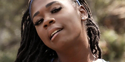 Stripteasing ebony teen makes eyes at camera
