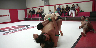 Public naked lez wrestlers fight on mat in front of audience