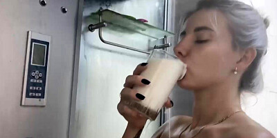 Milk on the Big Tits of a Hot Blonde