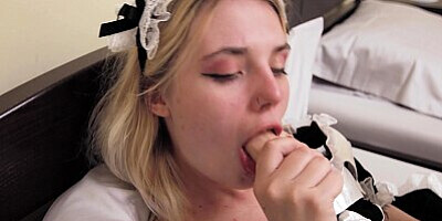 Horny blonde maid Angelina Bong plays with a sex toy in a hotel room.