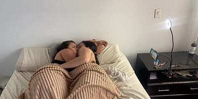 Lesbian sex under the covers on a cold morning