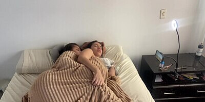 Lesbian sex under the covers on a cold morning