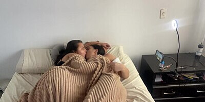 Lesbian sex under the covers on a cold morning