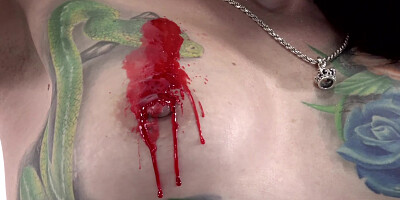 Tattooed babe Marie Bossette covers herself in hot wax