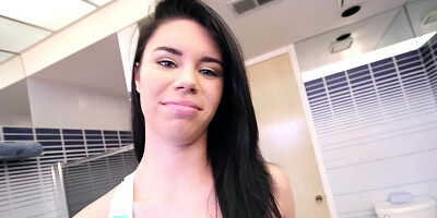 A raven haired princess is in the bathroom and she is giving a blow job