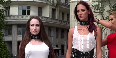 Two sex slaves fucked in public