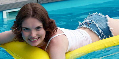 ...Smiley teen Milka Wey masturbates passionately by the pool...
