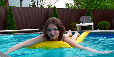 ...Smiley teen Milka Wey masturbates passionately by the pool...