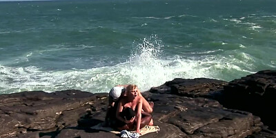Hot blonde screwed on the beach by white and black guys