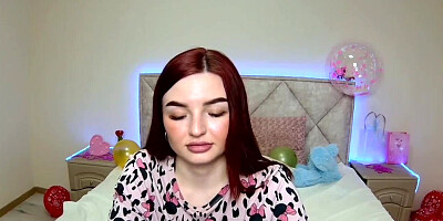 Big tits redhead strips to bra