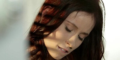 A redhead plays with her cunt in front of the camera for us