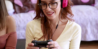 Two horny teens play with each others clits while gaming