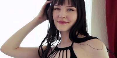 Amelia Riven uses dildo to penetrate her crotchless fishnet bodysuit and masturbate