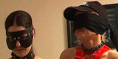 Masked German babes sucking dick after BDSM threesome