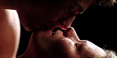 Erotic couple covered in water makes love in the dark