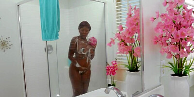 Girl joins black babe masturbating in shower and licks the muff