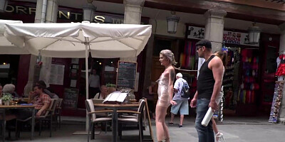 Blonde wrapped in plastic in public