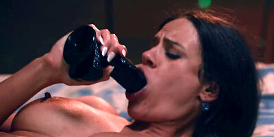 Cute brunette sucking a dildo while the man rocks her