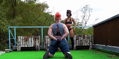 Two horny ladies are doing a fetish photoshoot outdoors
