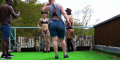 Two horny ladies are doing a fetish photoshoot outdoors