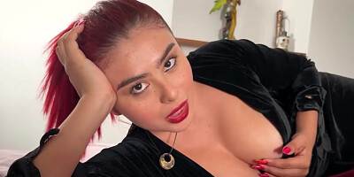 Crimson haired honey is displaying her cute, Spanish backside on webcam while toying with her bra-stuffers