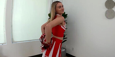 Adorable cheerleader babe is going to cheer this dick up