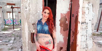 Redhead is having some sex while outside in a ruin