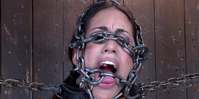 Slave immobilized in chains and leather