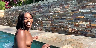 Naked ebony MILF fingers her hairy pussy