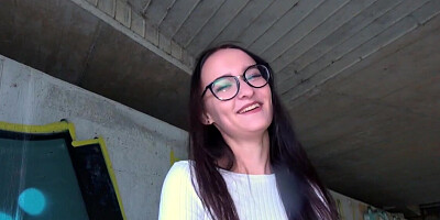 Glasses girl strokes that dick and takes it under the bridge