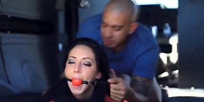 Gorgeous Sabrina Banks is tied in the back of a van