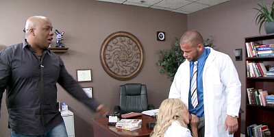 A kinky blonde is sucking the doctors dick in his office