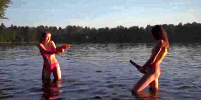 Erika and Margo, both 19, have hardcore lesbian sex outdoors complete with tit sucking, pussy licking and fingering next to a lake.