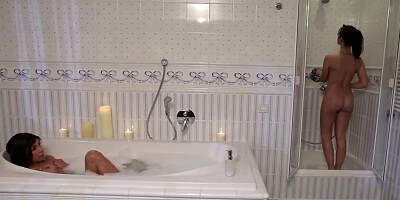 Sweet brunette lesbians enjoy good fucking in the bathtub