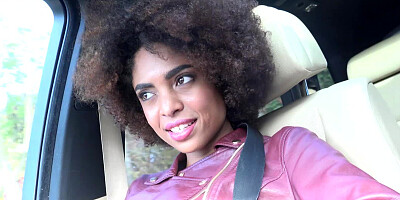 Curly Ebony girl welcomes white dude's rod in a car after a trip