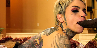 Tattooed girl in fishnets shows sexual talents in gangbang video