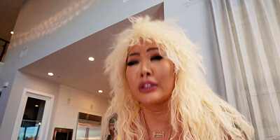 Connie Perignon in a wig gets banged sideways on a bed