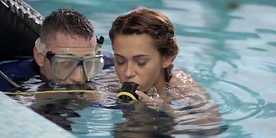 Alexis Brill and diving instructor are making out by the pool