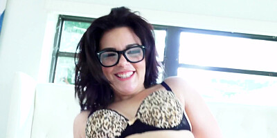 Chick with glasses that has a shaved cunt is spreading her legs