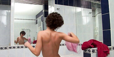 Dasha D is washing herself and showing off her impressive body